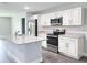 Modern kitchen with white cabinets and granite countertops at 13435 Kaplan Ter, Port Charlotte, FL 33981