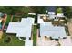 Aerial view of two houses with gray roofs and fenced yards at 1801 40Th N St, St Petersburg, FL 33713