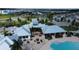 Community aerial view showcasing clubhouse, pool, and surrounding residential area at 12764 Weston Oaks Ln, Riverview, FL 33579