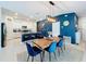 Open-concept living space featuring a dining table, kitchen, and a view of the kitchen island at 12764 Weston Oaks Ln, Riverview, FL 33579