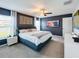 This bedroom features a ceiling fan, gray walls, art, and a window at 12764 Weston Oaks Ln, Riverview, FL 33579
