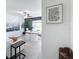 Spacious office shows chalkboard accent wall, white desk, and inspiring artwork with comfortable sofa at 12764 Weston Oaks Ln, Riverview, FL 33579