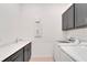 Laundry room with washer, dryer, and utility sink at 5735 Shorebird Br, Land O Lakes, FL 34638