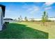 Large backyard with grassy area, privacy fence, and mature trees at 5735 Shorebird Br, Land O Lakes, FL 34638
