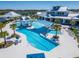 Large, resort-style pool with shaded seating and plenty of lounge chairs at 5735 Shorebird Br, Land O Lakes, FL 34638