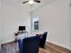 Versatile bonus room with two armchairs and a TV at 5735 Shorebird Br, Land O Lakes, FL 34638