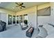 Covered patio features fire pit, seating, and outdoor kitchen at 5735 Shorebird Br, Land O Lakes, FL 34638