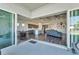 Open floor plan showcasing kitchen, living room, and dining area with sliding glass doors at 5735 Shorebird Br, Land O Lakes, FL 34638