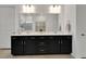 Double vanity bathroom with modern dark cabinets and quartz countertops at 5735 Shorebird Br, Land O Lakes, FL 34638