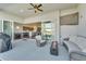 Covered patio with comfortable seating and view into the kitchen at 5735 Shorebird Br, Land O Lakes, FL 34638
