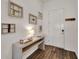Bright entryway with a console table and decorative reclaimed windows at 5735 Shorebird Br, Land O Lakes, FL 34638