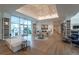 Bright and spacious community clubhouse lobby with hardwood floors at 5735 Shorebird Br, Land O Lakes, FL 34638