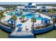 Resort-style pool with cabanas, lounge chairs, and a view of the lake at 5735 Shorebird Br, Land O Lakes, FL 34638