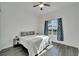 Spacious bedroom with a king-size bed and wood-look floors at 5735 Shorebird Br, Land O Lakes, FL 34638