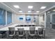 Modern meeting room with a large table and comfortable chairs at 5735 Shorebird Br, Land O Lakes, FL 34638
