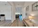 Bright and airy entryway with wood-look floors, leading to the living room at 5735 Shorebird Br, Land O Lakes, FL 34638