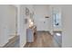 Bright entryway with wood-look floors and a stylish console table at 5735 Shorebird Br, Land O Lakes, FL 34638
