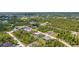 Aerial view of the community highlighting the wooded landscape at 8489 Topeka Cir, Port Charlotte, FL 33981