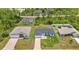 Aerial view of a new home showing the roof, lawn, and surrounding neighborhood at 8489 Topeka Cir, Port Charlotte, FL 33981