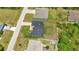 This aerial view showcases the house and surrounding neighborhood at 8489 Topeka Cir, Port Charlotte, FL 33981