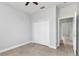 This bedroom features neutral walls, tile floors, closet and ceiling fan at 8489 Topeka Cir, Port Charlotte, FL 33981