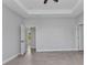 Bright bedroom with neutral walls, tile floors and a doorway to another room at 8489 Topeka Cir, Port Charlotte, FL 33981