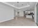 Spacious living area with tile flooring, ample natural light, and view into the kitchen area at 8489 Topeka Cir, Port Charlotte, FL 33981