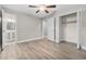 Large bedroom with ceiling fan, ample closet space and luxury vinyl flooring at 304 W Fern St, Tampa, FL 33604