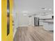 Open concept living and kitchen area with modern flooring and finishes at 304 W Fern St, Tampa, FL 33604