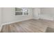 Bright and airy living room with luxury vinyl plank flooring and large windows at 304 W Fern St, Tampa, FL 33604