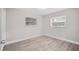 Well-lit bedroom featuring wood-look floors at 304 W Fern St, Tampa, FL 33604