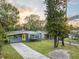 Charming house with a yellow door and well-maintained landscaping at 304 W Fern St, Tampa, FL 33604