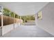 Covered patio with screened enclosure and concrete floor at 304 W Fern St, Tampa, FL 33604