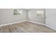 Bright bedroom with wood-look floors and neutral walls at 304 W Fern St, Tampa, FL 33604