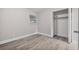 Bedroom with wood-look floors and spacious closet at 304 W Fern St, Tampa, FL 33604