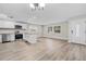Modern kitchen with white cabinets, stainless steel appliances, and granite countertops at 304 W Fern St, Tampa, FL 33604