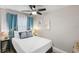 Cozy bedroom with a queen bed and coastal decor at 20000 Gulf Blvd # 707, Indian Shores, FL 33785