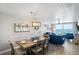 Bright dining area with ocean view and table set for a meal at 20000 Gulf Blvd # 707, Indian Shores, FL 33785
