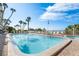 Inviting pool area with lounge chairs and ocean views at 20000 Gulf Blvd # 707, Indian Shores, FL 33785