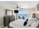 Main bedroom with king-size bed and ocean view from the window at 20000 Gulf Blvd # 707, Indian Shores, FL 33785