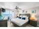 Main bedroom with a king-size bed, ocean view, and private balcony access at 20000 Gulf Blvd # 707, Indian Shores, FL 33785