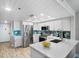Modern kitchen featuring stainless steel appliances and white cabinetry at 20000 Gulf Blvd # 707, Indian Shores, FL 33785