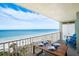Oceanfront balcony with table and chairs, perfect for dining at 20000 Gulf Blvd # 707, Indian Shores, FL 33785