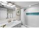 Clean bathroom with white vanity and subway tile at 20000 Gulf Blvd # 707, Indian Shores, FL 33785
