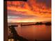 Stunning sunset over calm water with lush greenery at 5915 Sea Ranch Dr # 410, Hudson, FL 34667