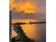 Beautiful waterfront view at sunset reflecting golden light at 5915 Sea Ranch Dr # 410, Hudson, FL 34667