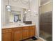Bathroom with shower and wood vanity at 5846 Greenbriar Ct, Zephyrhills, FL 33542
