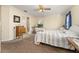 Bright bedroom with a striped bedspread and en-suite bathroom access at 5846 Greenbriar Ct, Zephyrhills, FL 33542