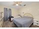 Well-lit bedroom with twin and double beds at 5846 Greenbriar Ct, Zephyrhills, FL 33542