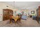 Dining room with wooden table and chairs, view to living room at 5846 Greenbriar Ct, Zephyrhills, FL 33542